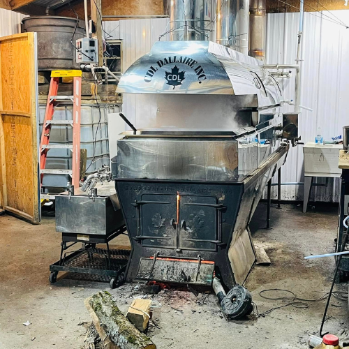 A wood power stove for maple inside of a building.