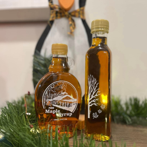 A close up of maple bottles.